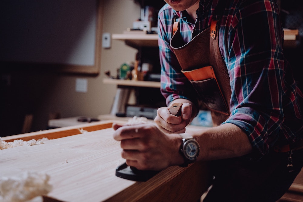 man working with wood