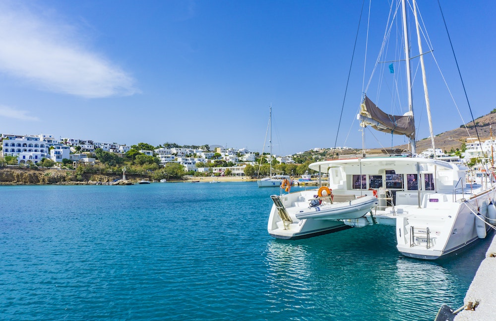 catamaran on blue water in Greece